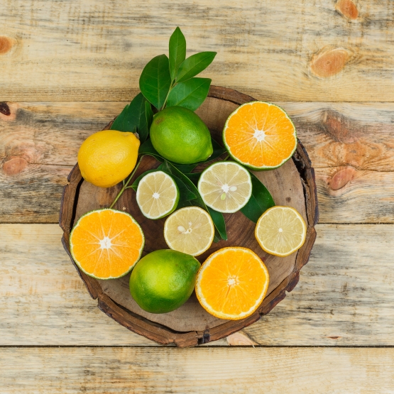3 some citrus fruits on a wooden board on wooden board