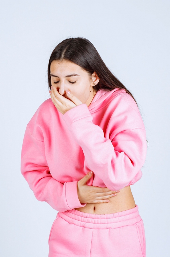 girl is coughing or vomiting because of pregnancy