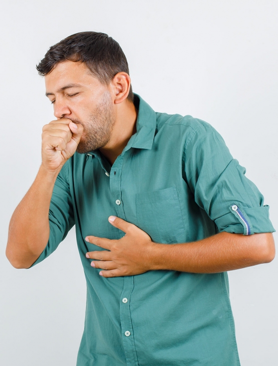 young man suffering from cough in shirt and looking ill